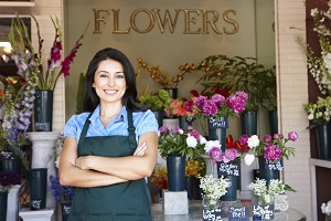 woman standing outside flower business