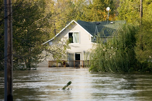 a two story house devastated by a flood